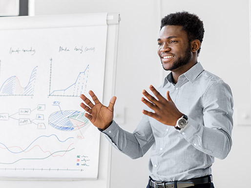 young man giving employee retirement planning presentation with charts and graphs