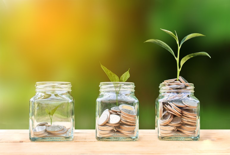 Three jars filled with coins and plants representing retirement savings and services offered by BlueStar 